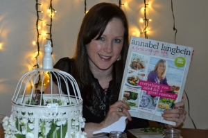 Amy Pearce holding Annabel Langbein's A Free Range Life Book